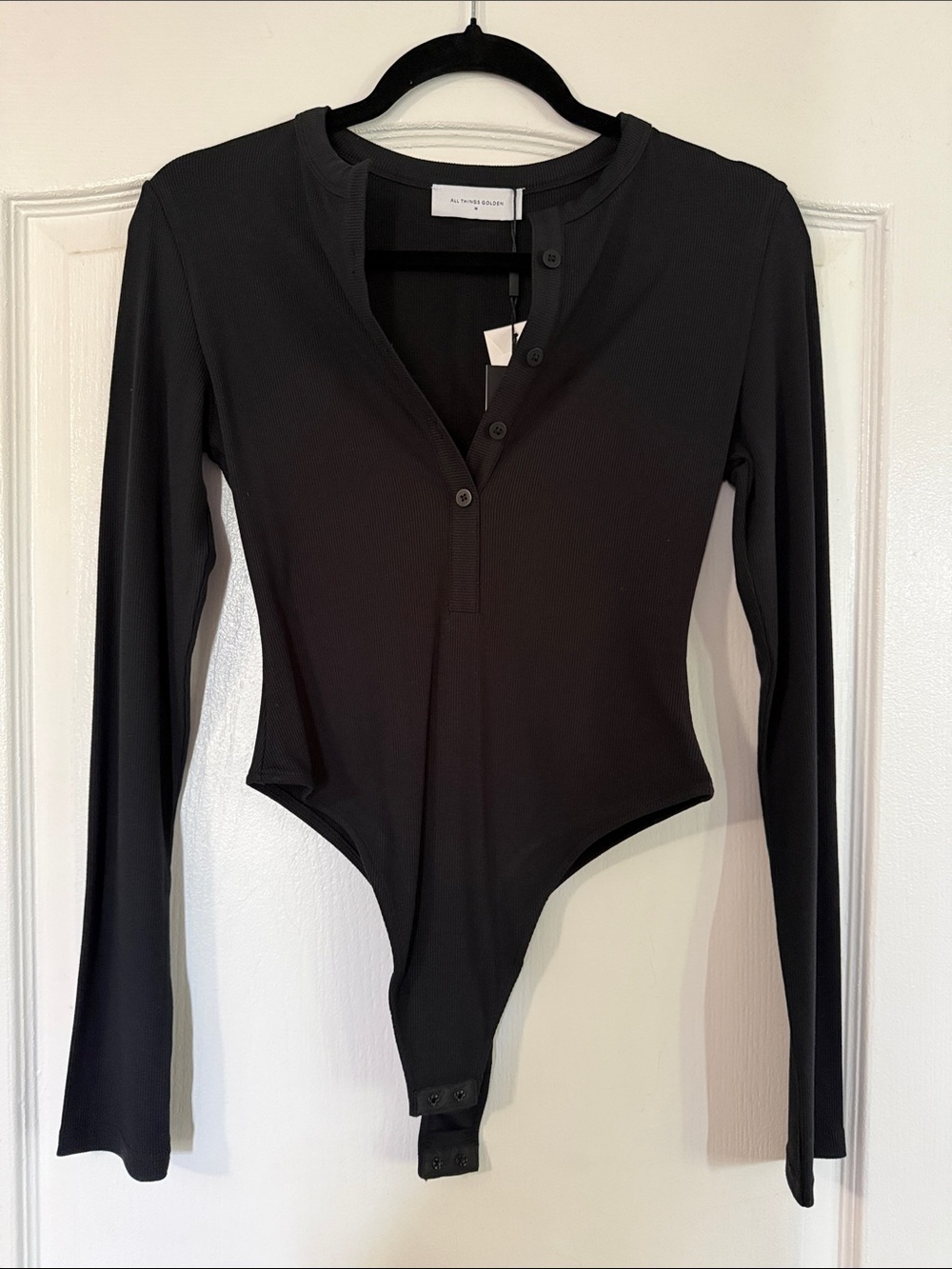 ALL THINGS GOLDEN Black Long-Sleeve Henley Snap Bodysuit
